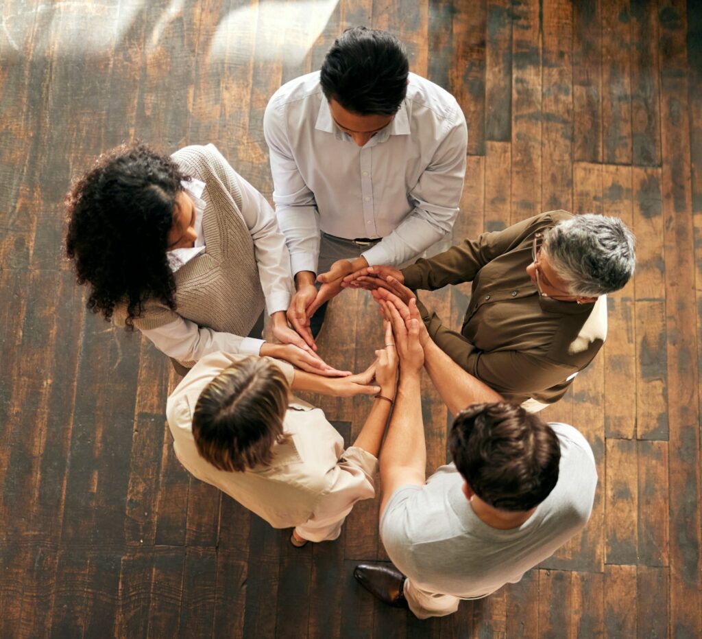 Teamwork, circle and synergy of people hands for collaboration, workflow and group or team building